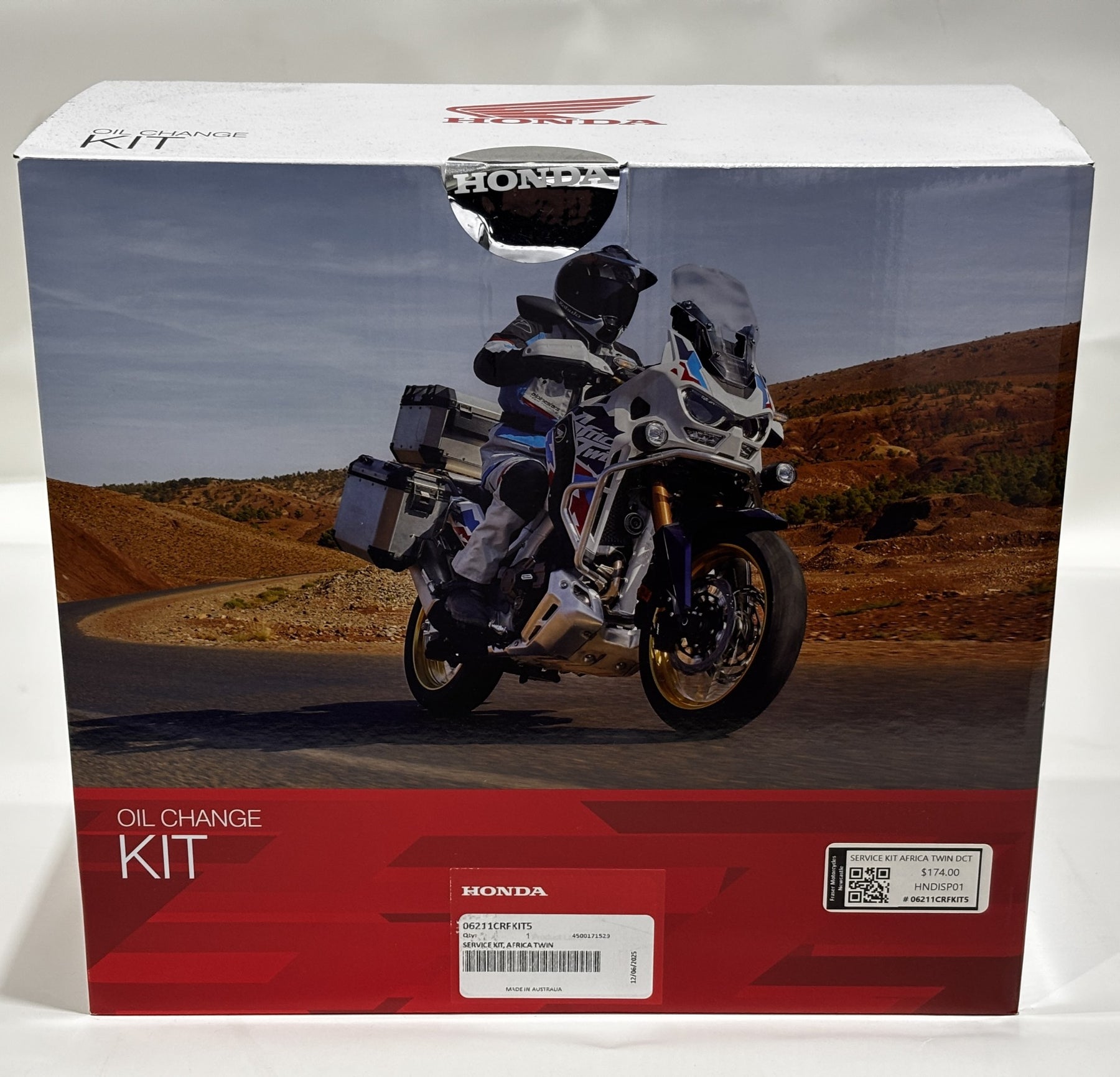 Honda oil change kit box with motorcycle on the road design
